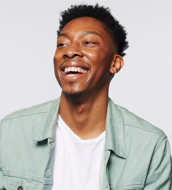 African American male with a large, bright smile.