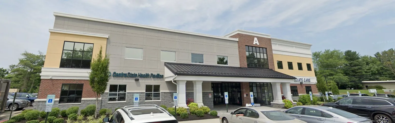 Exterior of the two-story TG Orthodontics building and parking lot in Marlboro, the office families visit when choosing an orthodontist in Freehold, NJ