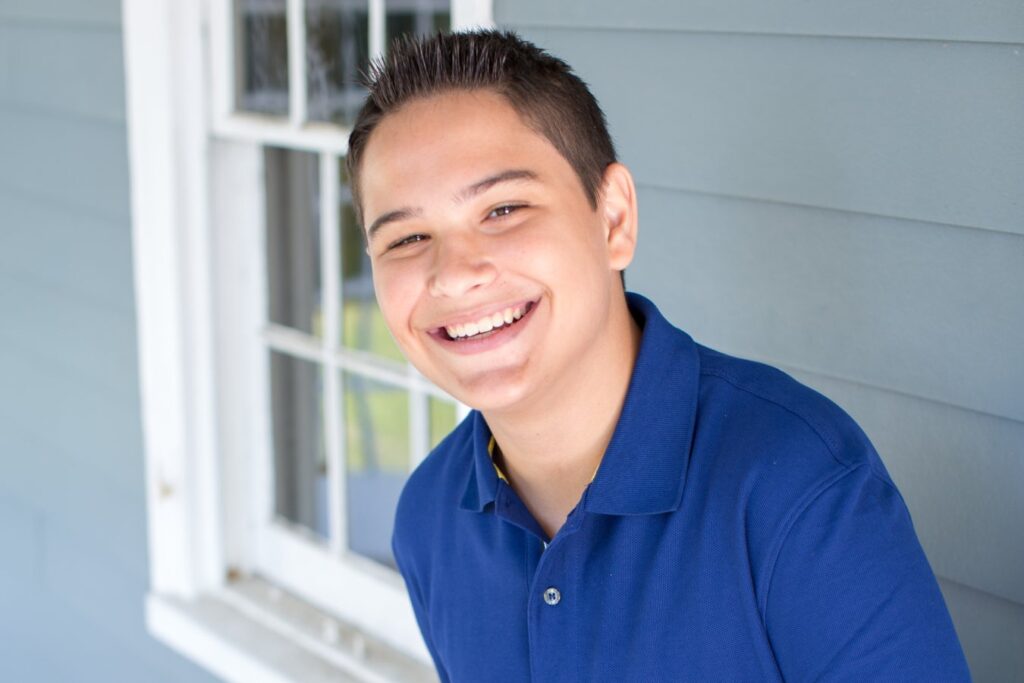 Young boy wearing an orthodontic appliance, illustrating how Invisalign palatal expanders work for growing smiles