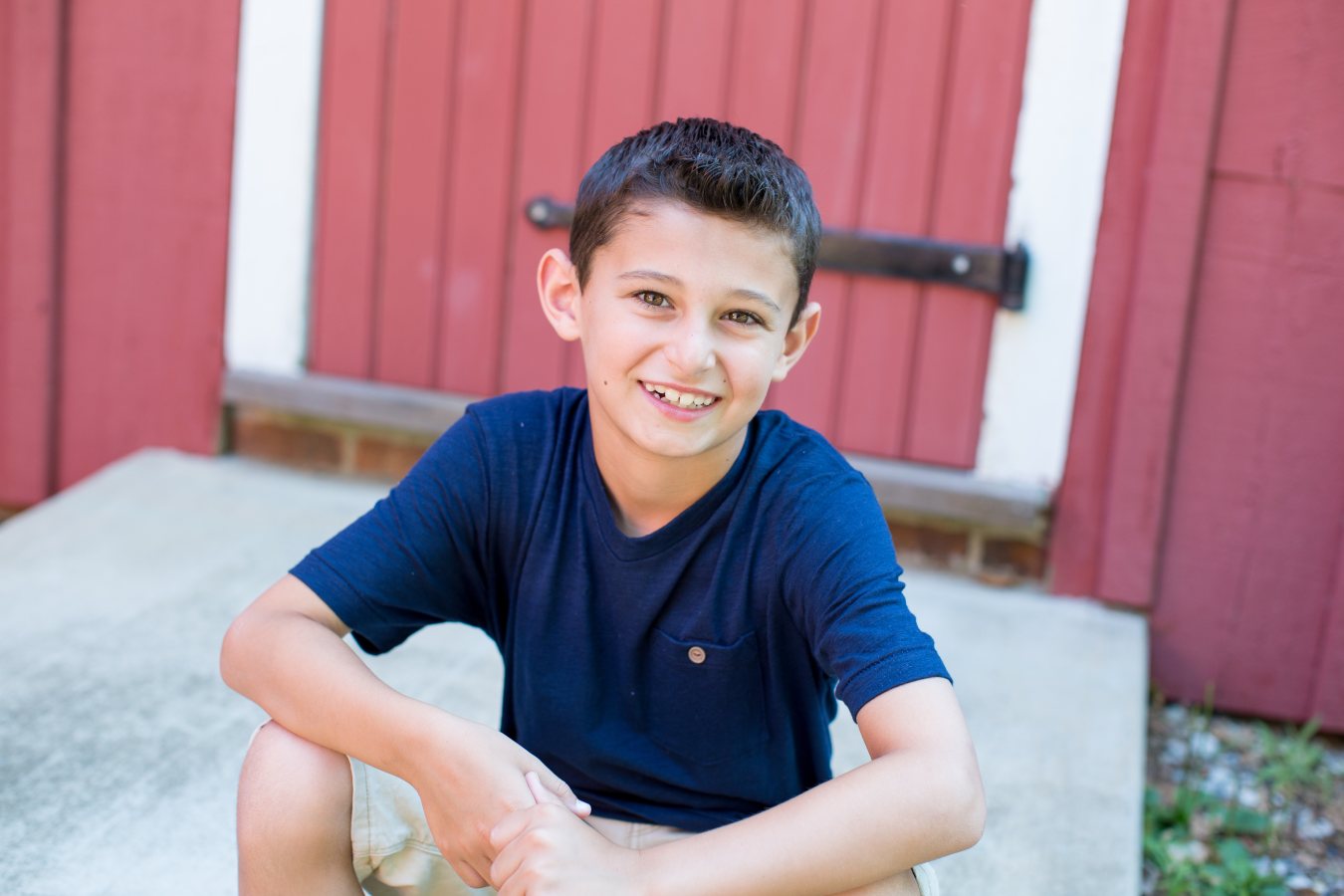 Young boy smiling with clear aligners, part of learning how to widen a palate with a removable expander